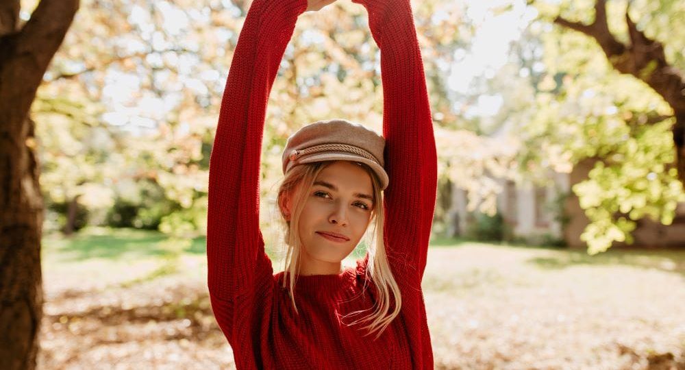 beautiful-blonde-girl-feels-happy-autumn-park-lovely-younf-woman-red-sweater-posing-leaves
